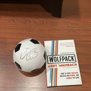 Abby wambach Wolfpack book and ball- both signed
